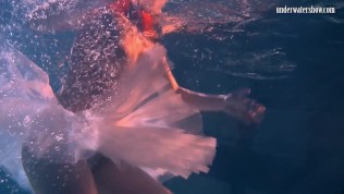 Bulava Lozhkova with a red tie and skirt underwater