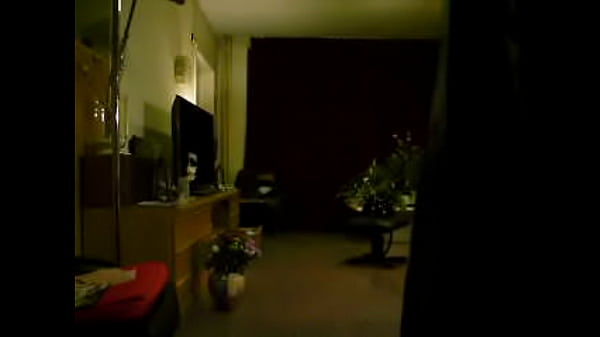 Mariska showing shiny plastic raincoat Elements rainwear